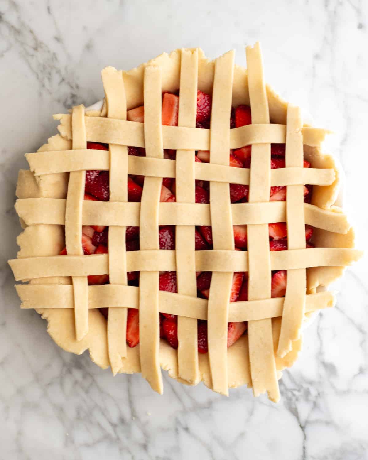 forming a lattice crust on top of a Strawberry Pie