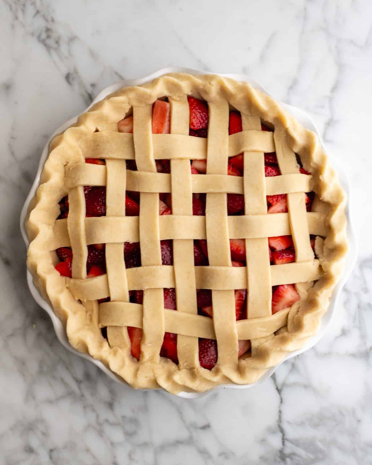 forming a lattice crust on top of a Strawberry Pie