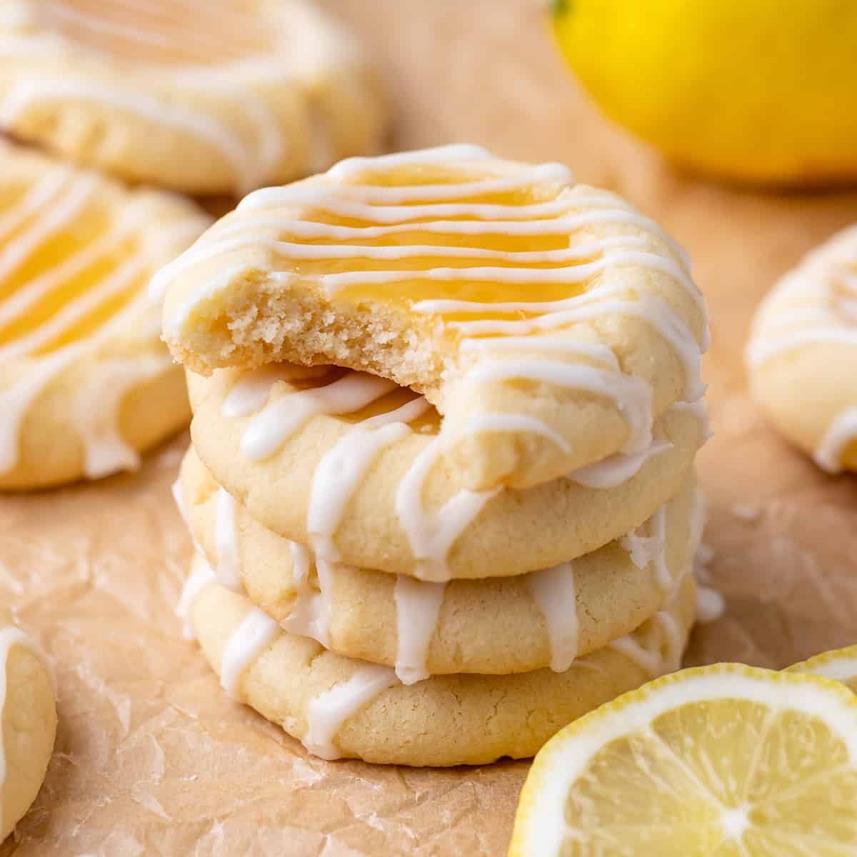 a stack of 4 Lemon Curd Cookies, the top one has a bite taken out of it