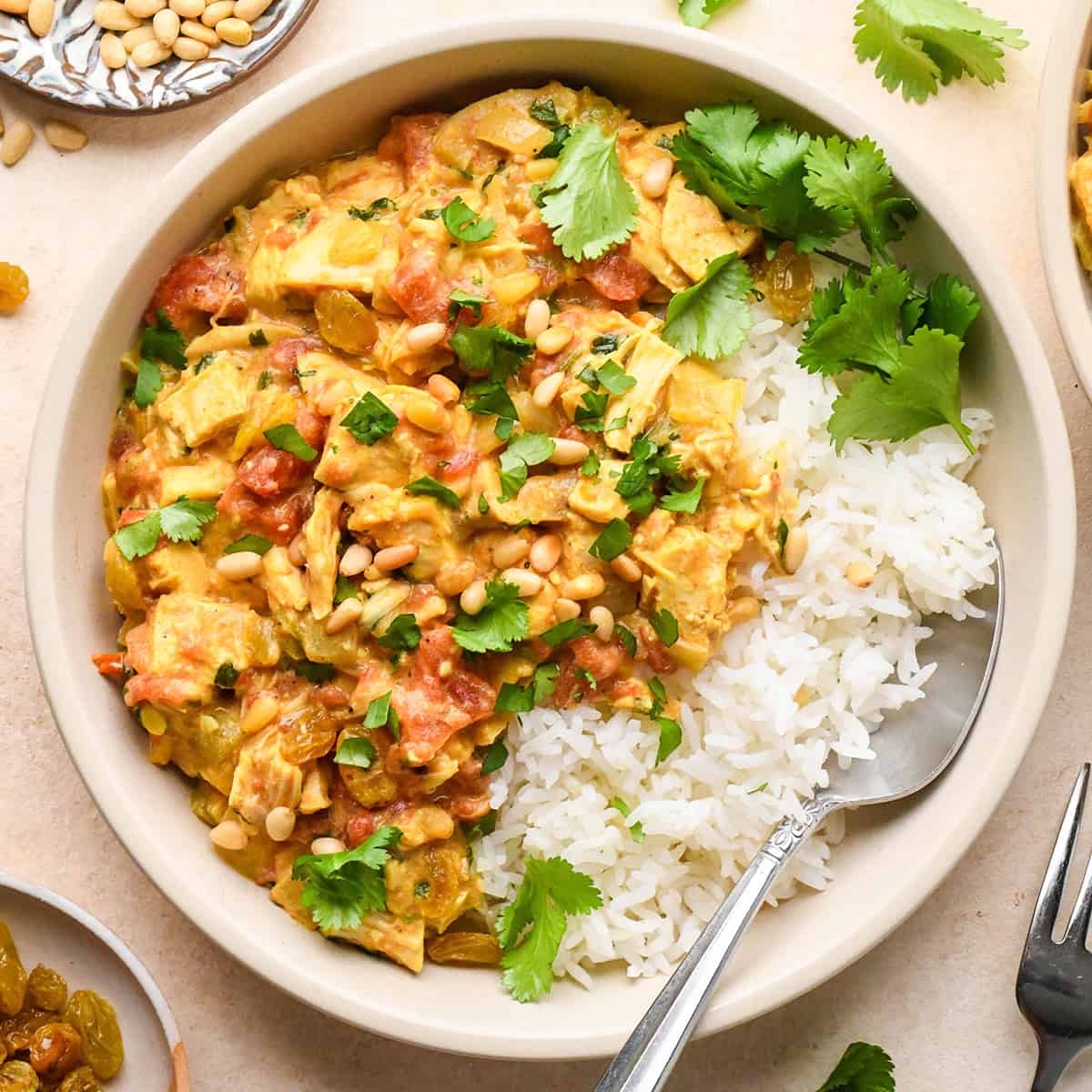 Easy Chicken Curry recipe in a bowl with rice and a spoon