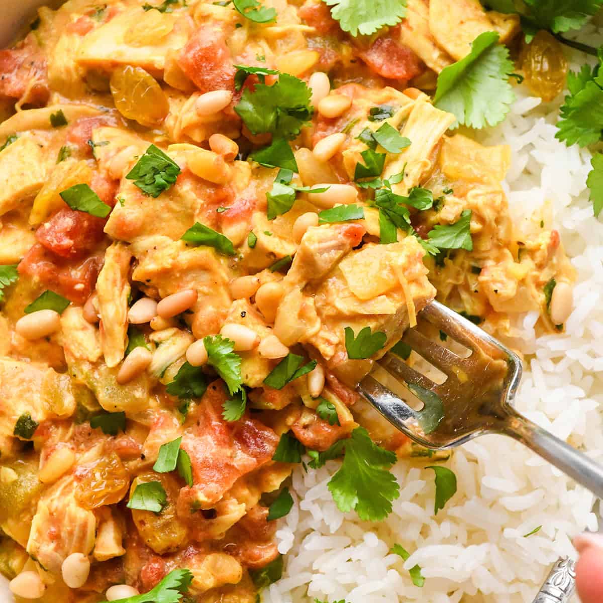 a fork taking a bite of Easy Chicken Curry recipe with rice