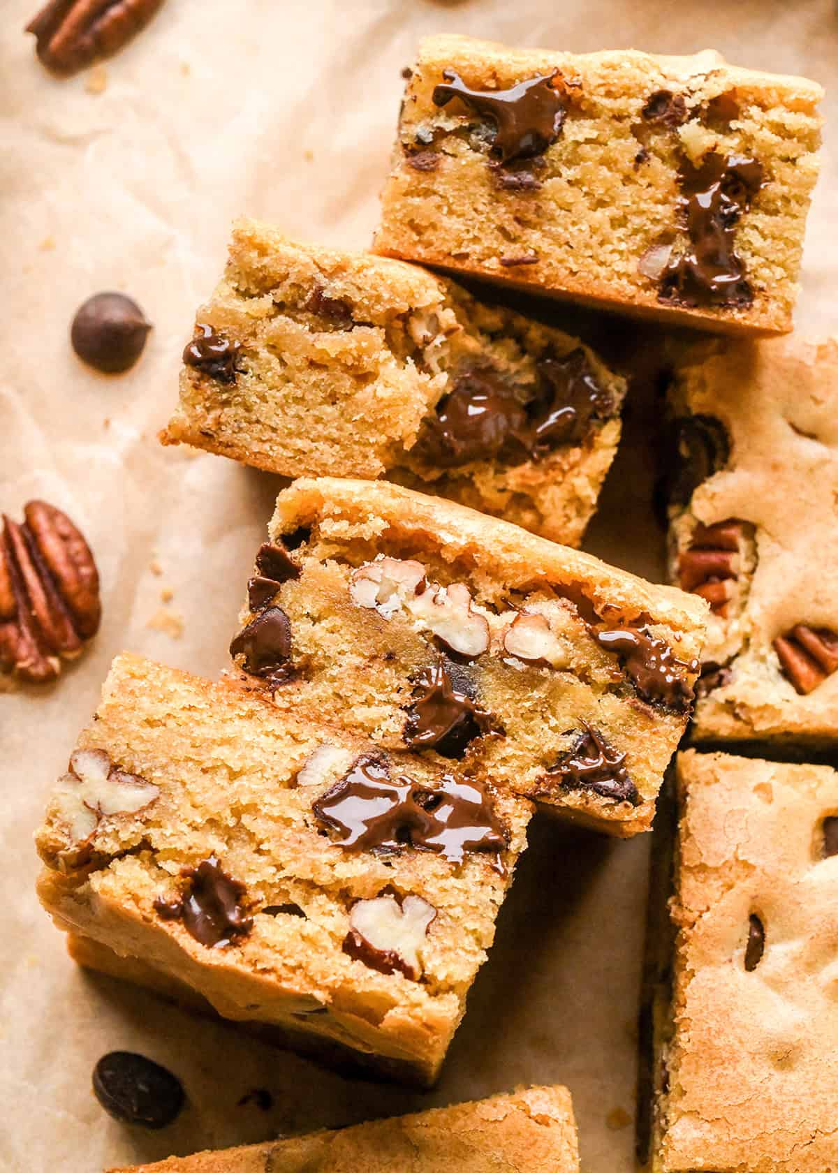 4 Browned Butter Blondies laying on their side, one has a bite taken out of it