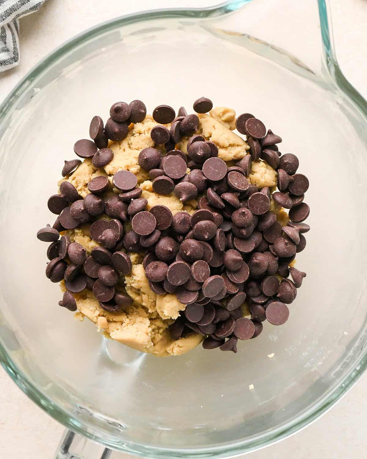 How to Make Eggless Chocolate Chip Cookies - chocolate chips added to dough before mixing