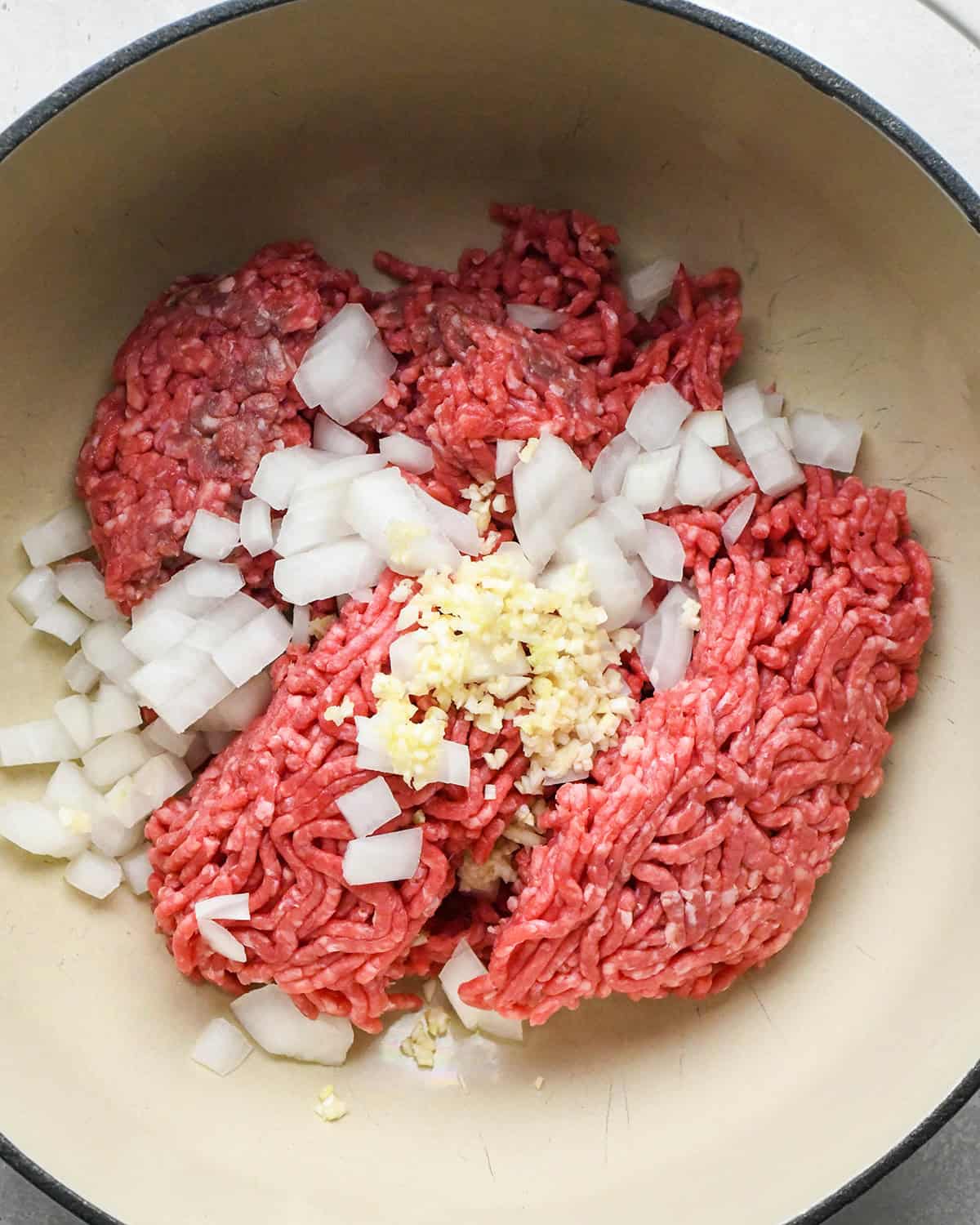 how to make Healthy Sloppy Joes - ground beef, onion and garlic in a pan before cooking