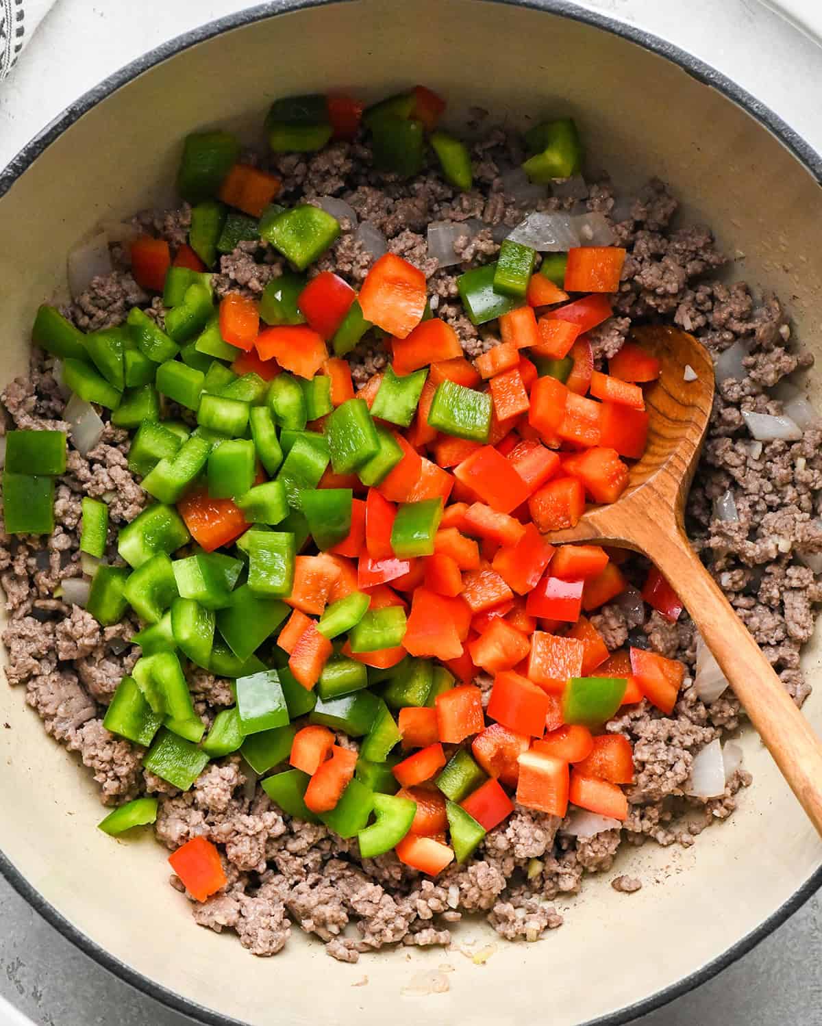 how to make Healthy Sloppy Joes - bell peppers added to ground beef before cooking