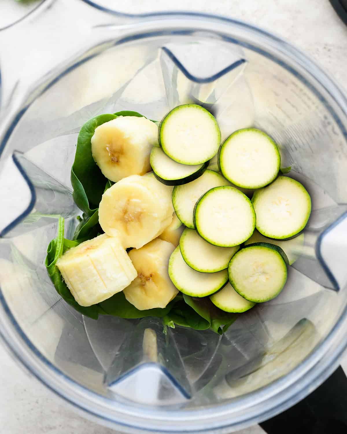 How to Make a Zucchini Smoothie - ingredients in a blender before blending