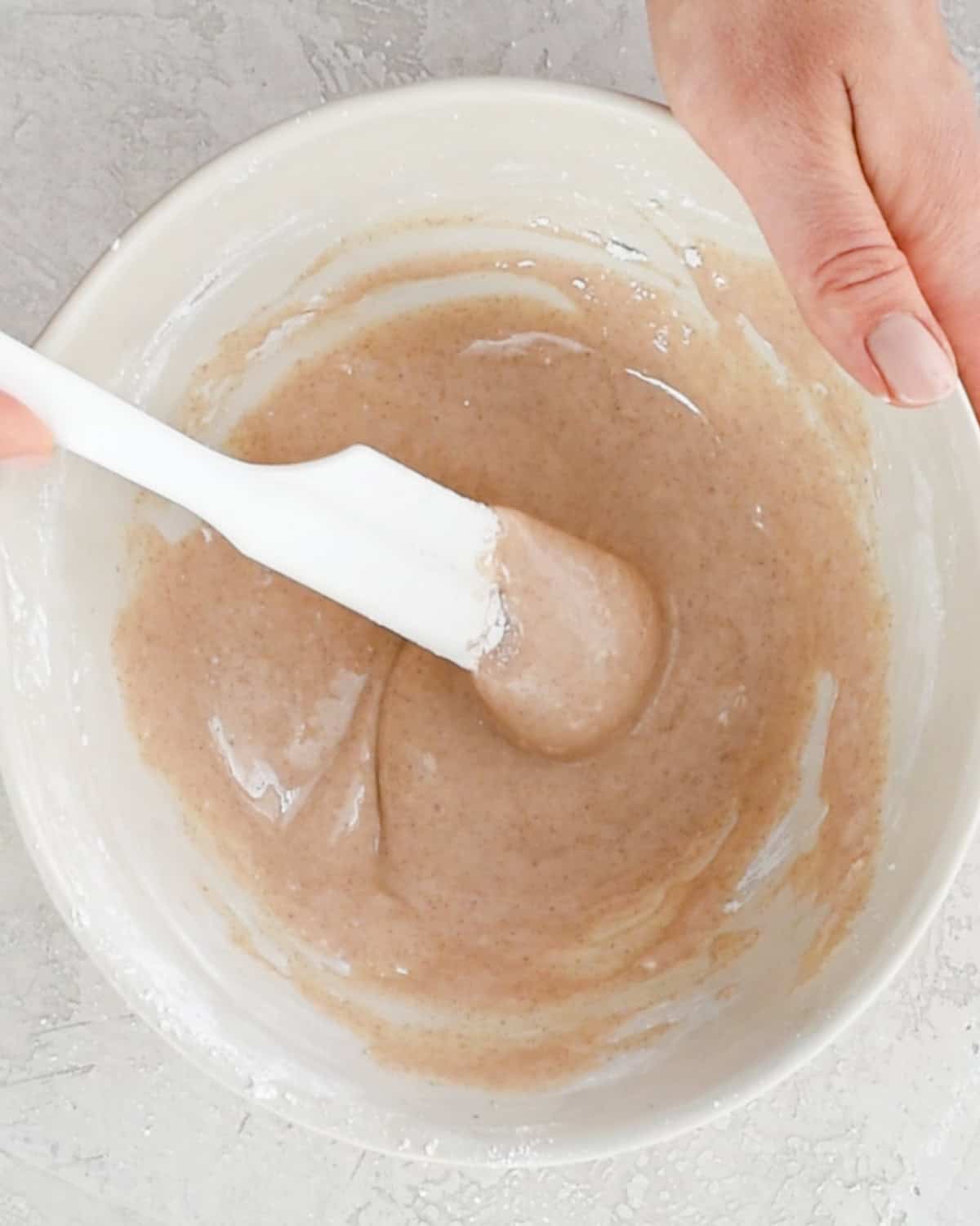 cinnamon glaze in a bowl after mixing