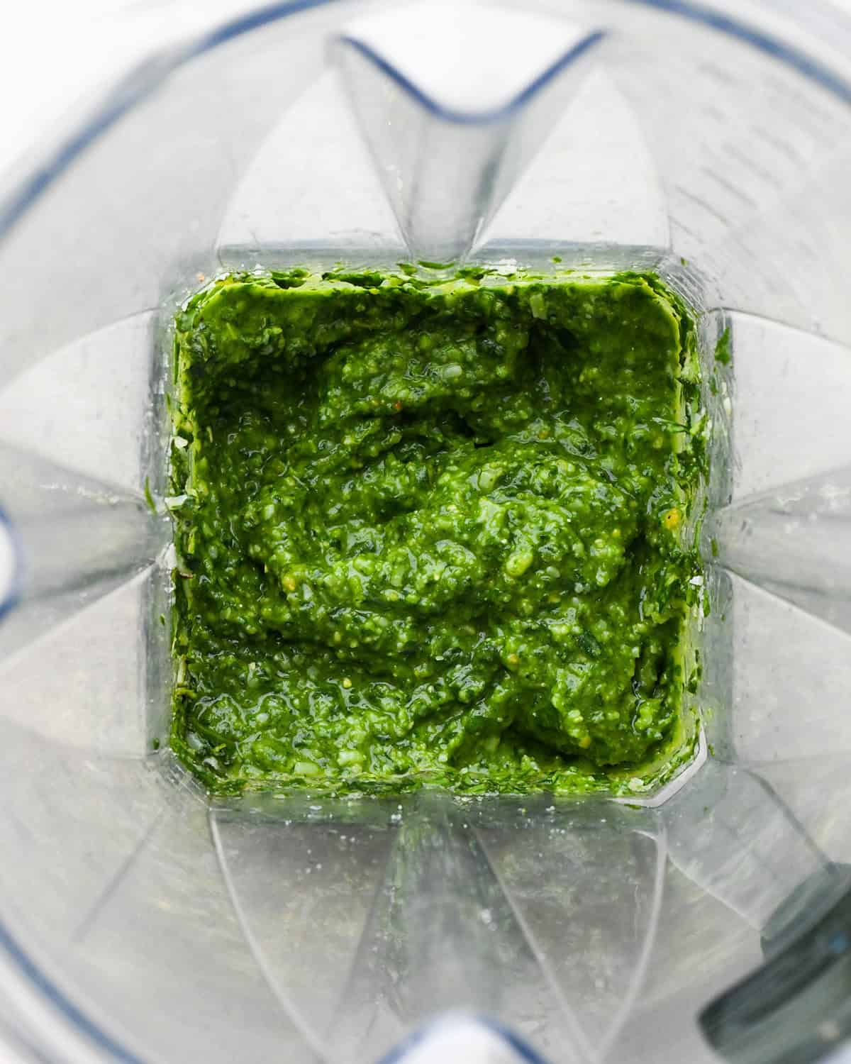 How to Make Pesto Sauce - final sauce in a blending container 