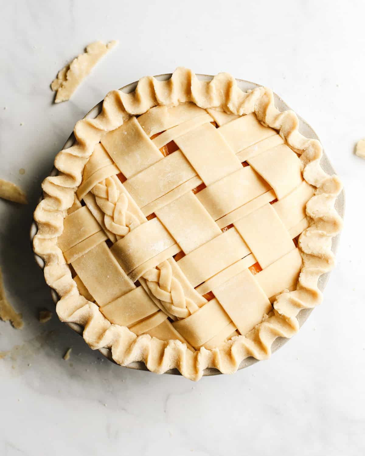 How to Make a Butter Pie Crust - assembled pie crust with lattice top and fluted edges