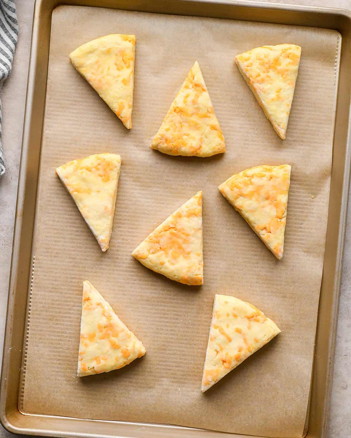 8 Cheese Scones on a baking sheet before baking