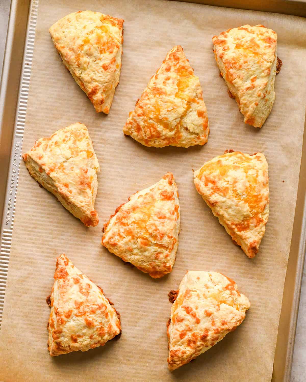 8 Cheese Scones on a baking sheet after baking