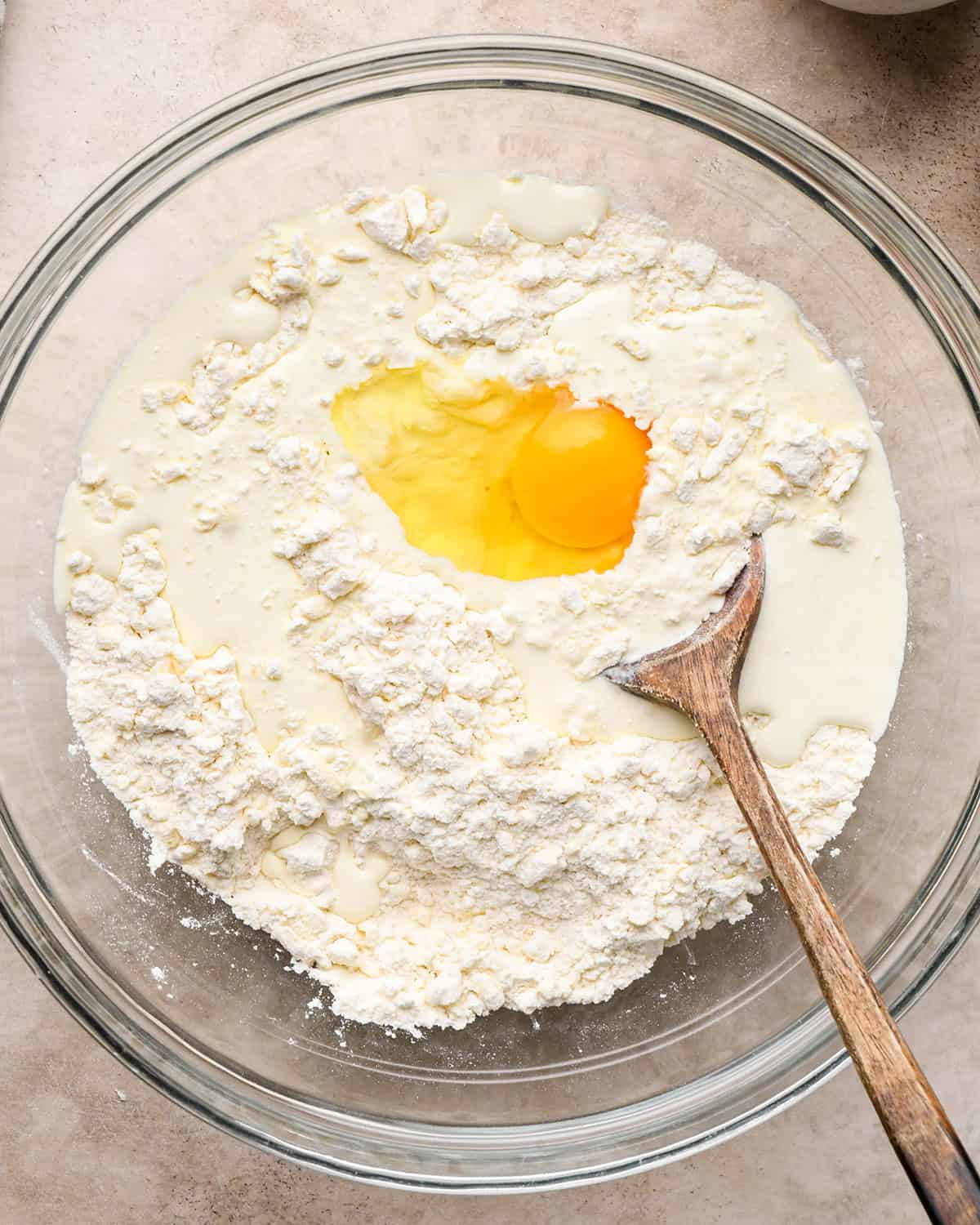 how to make cheese scones -  adding egg and craem