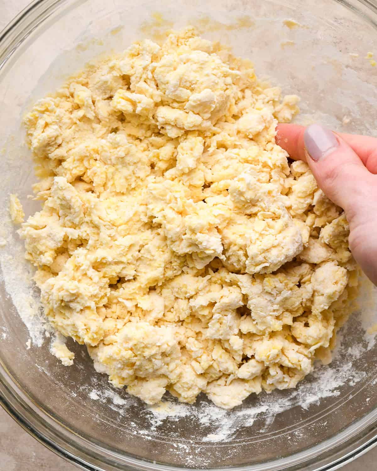 how to make cheese scones -  scone dough being mixed together in a bowl