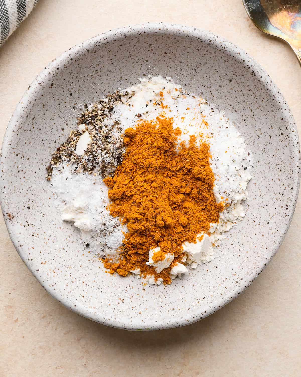 How to Make Chicken Curry - flour and spices in a bowl before stirring