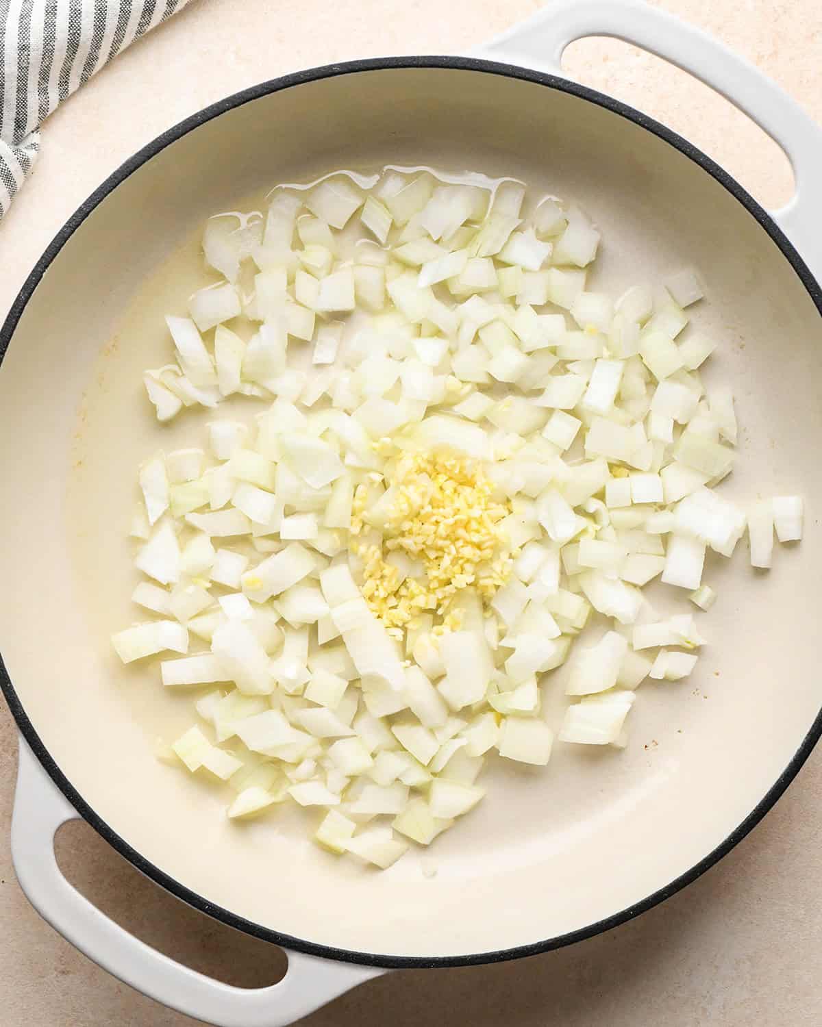 How to Make Chicken Curry - onion, garlic and olive oil in a pan before cooking