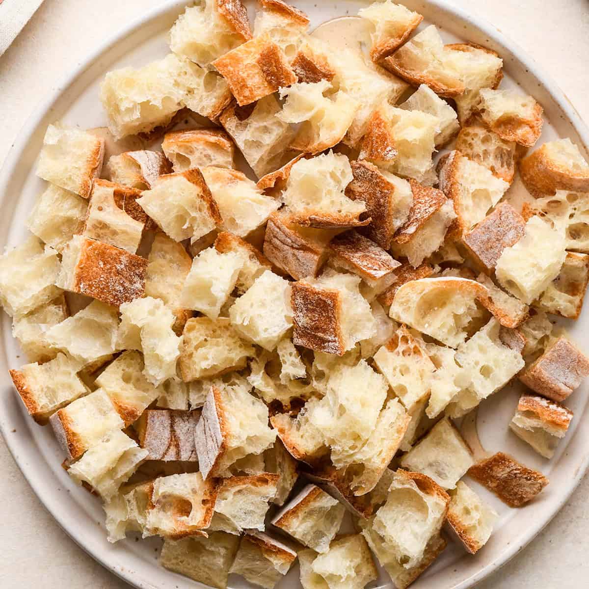 How to Make Croutons - bread cubed on a plate