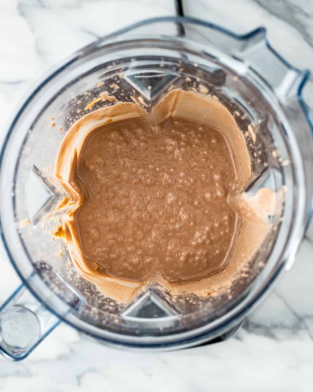Dairy Free Chocolate Peanut Butter Ice Cream base blended in a blending container