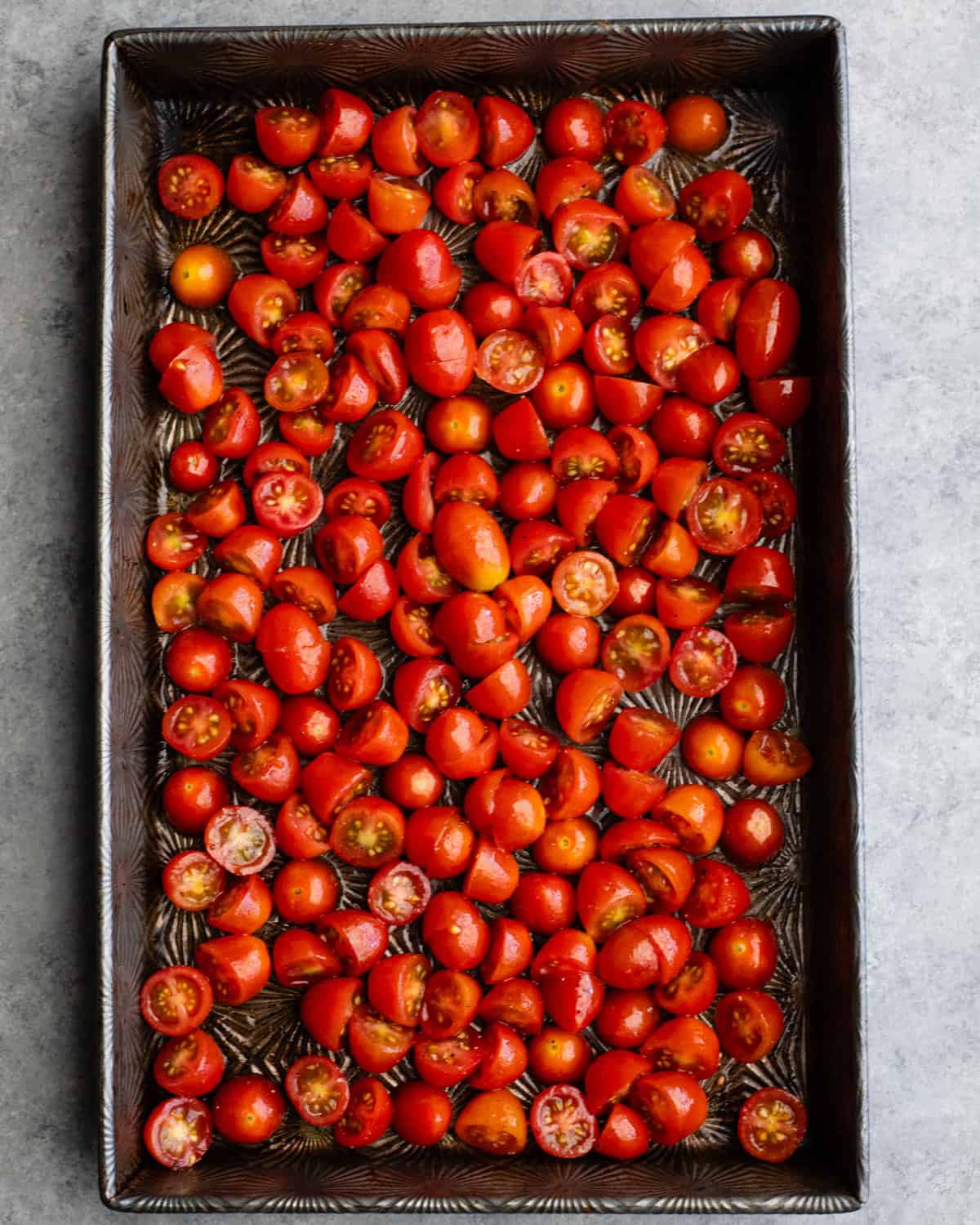 How to Make Pasta Salad - tomatoes on a baking sheet before roasting