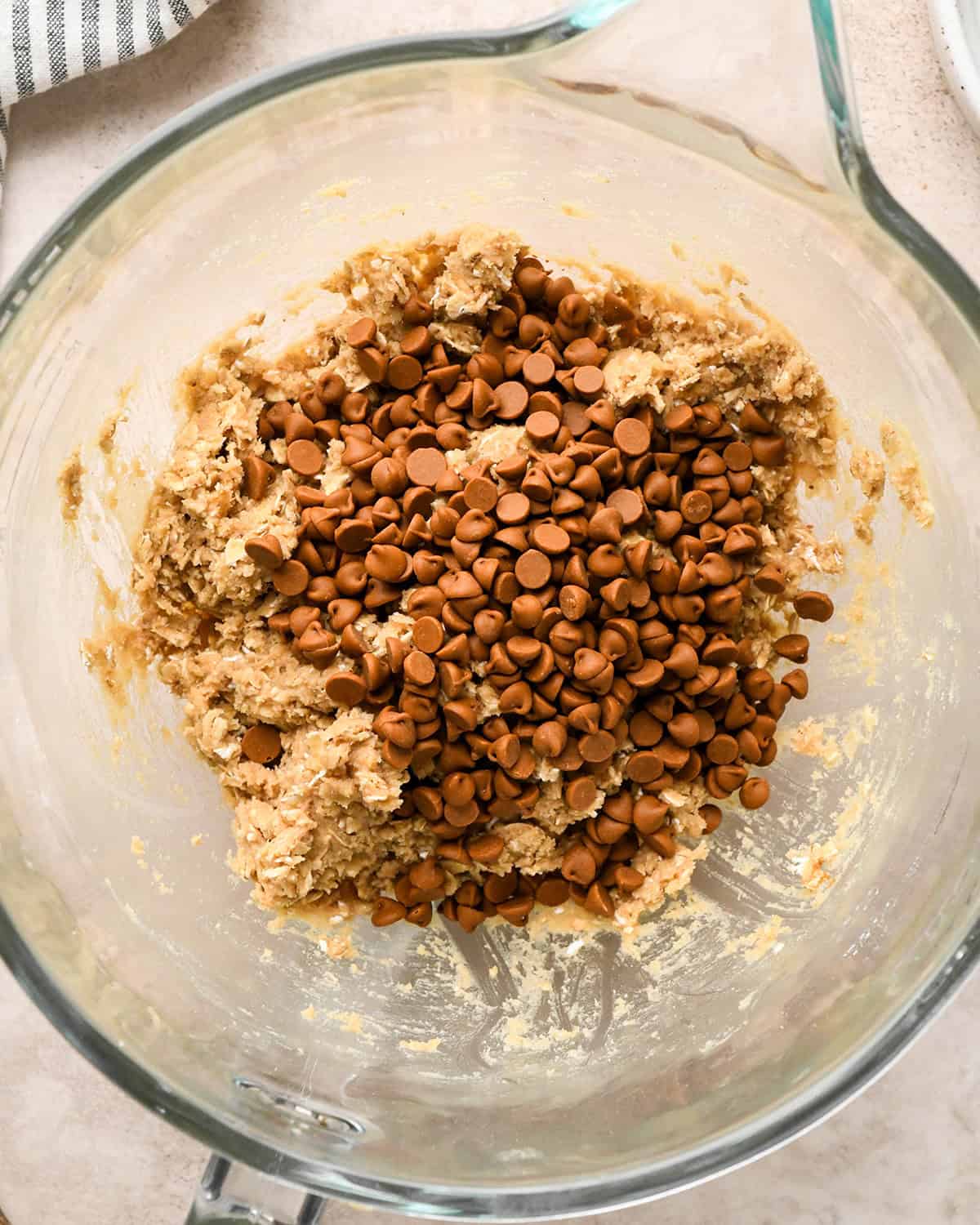 How to Make Iced Oatmeal Cookies - adding cinnamon chips before mixing