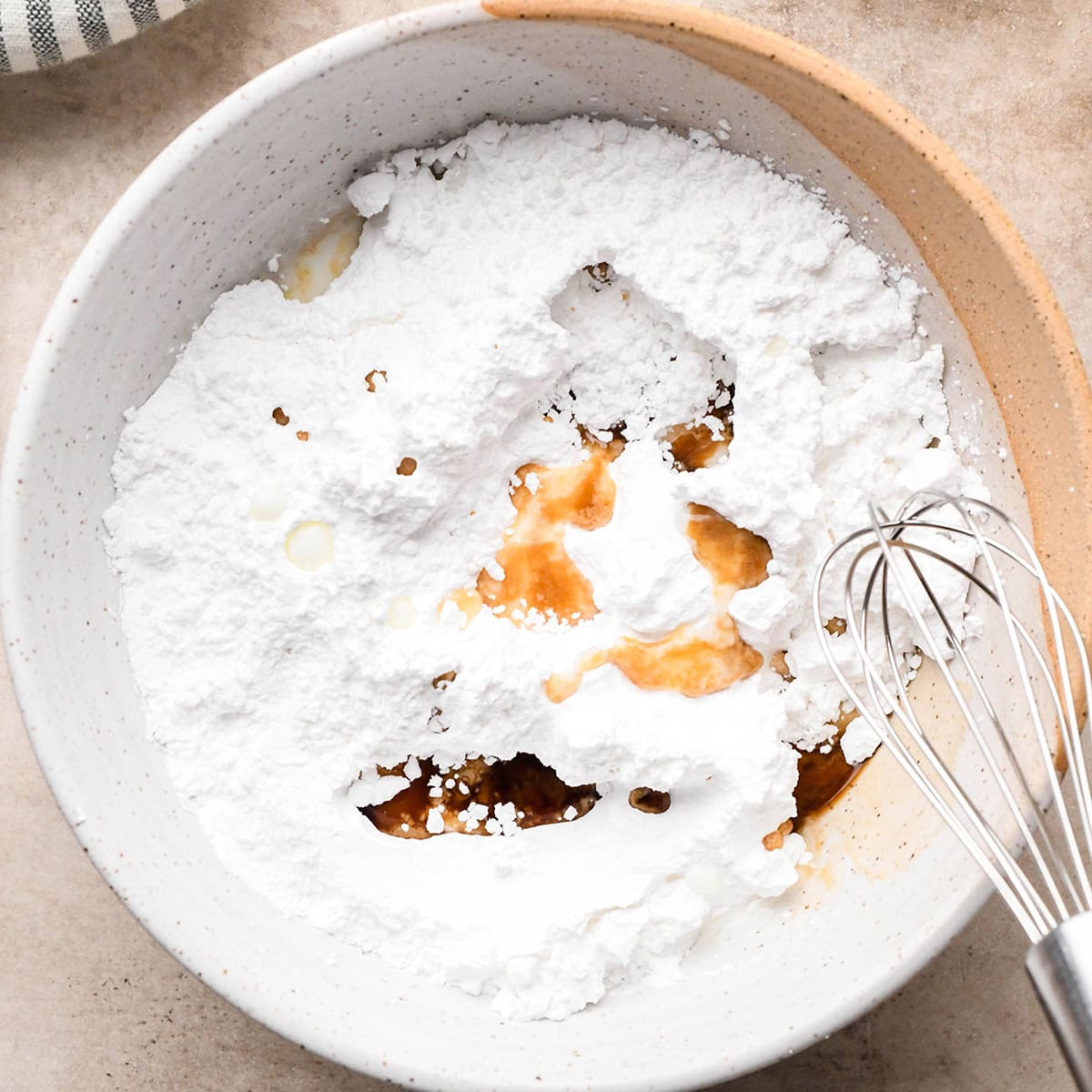 how to make Iced Oatmeal Cookies glaze - ingredients in a bowl before whisking