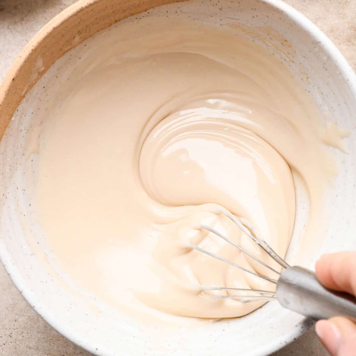 Iced Oatmeal Cookies glaze in a bowl after whisking