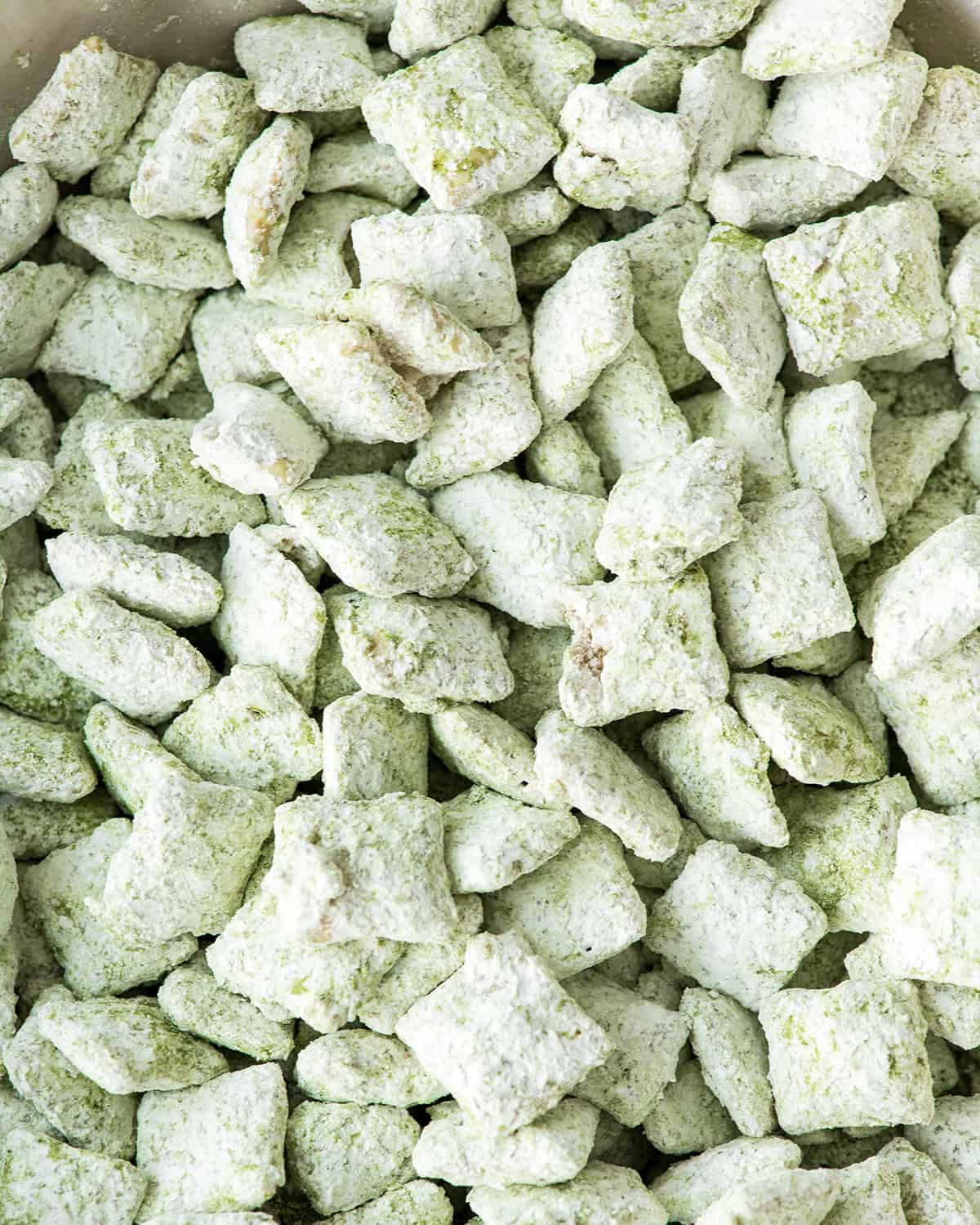 up close photo of Matcha Puppy Chow Recipe in a bowl