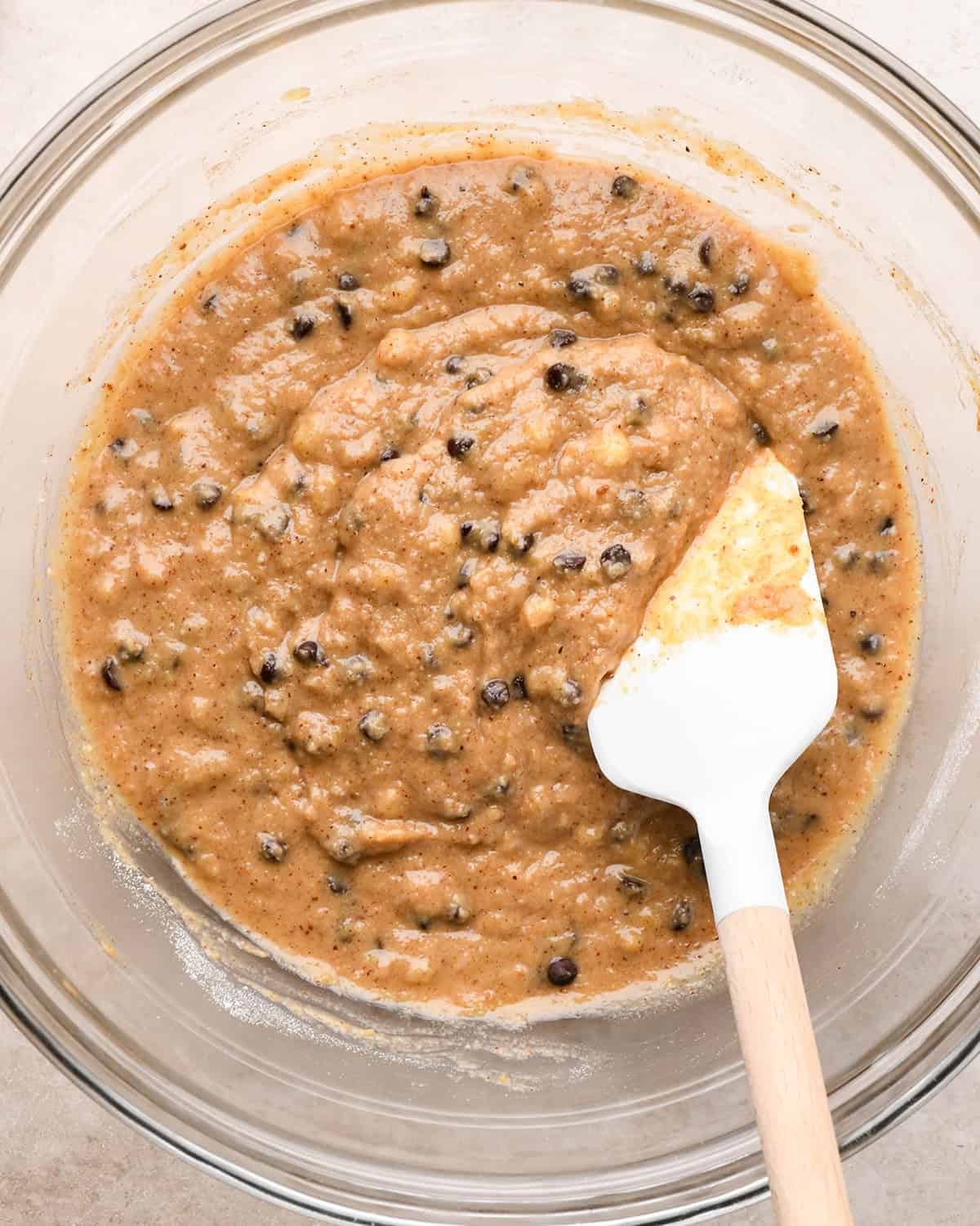 final paleo banana bread batter in a bowl with a spatula