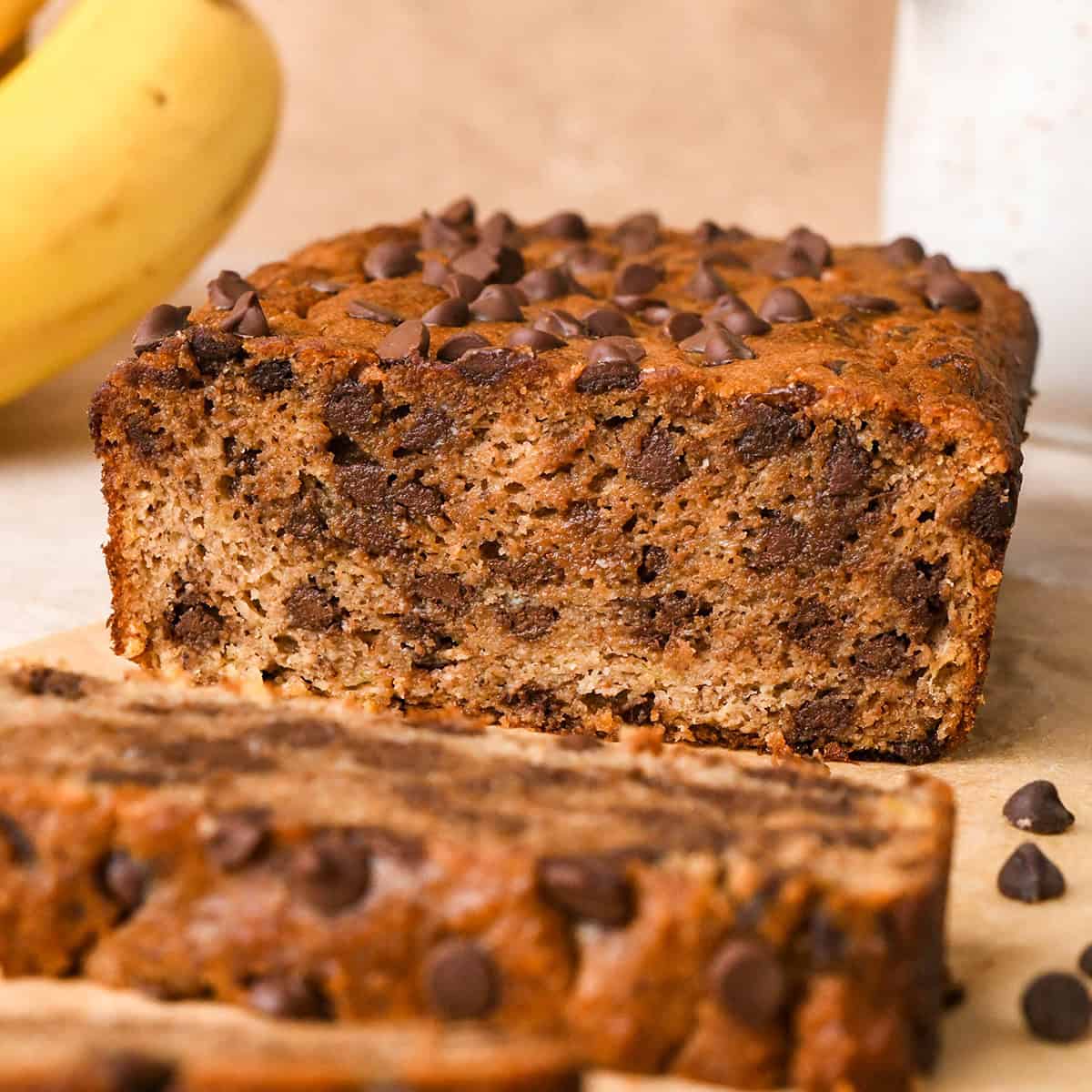 front view of a loaf of Paleo Banana Bread with two slices cut out of it