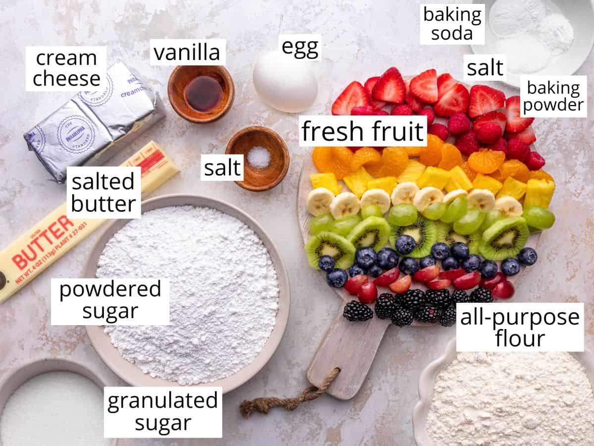 overhead photo of the labeled ingredients in this Rainbow Fruit Pizza Recipe