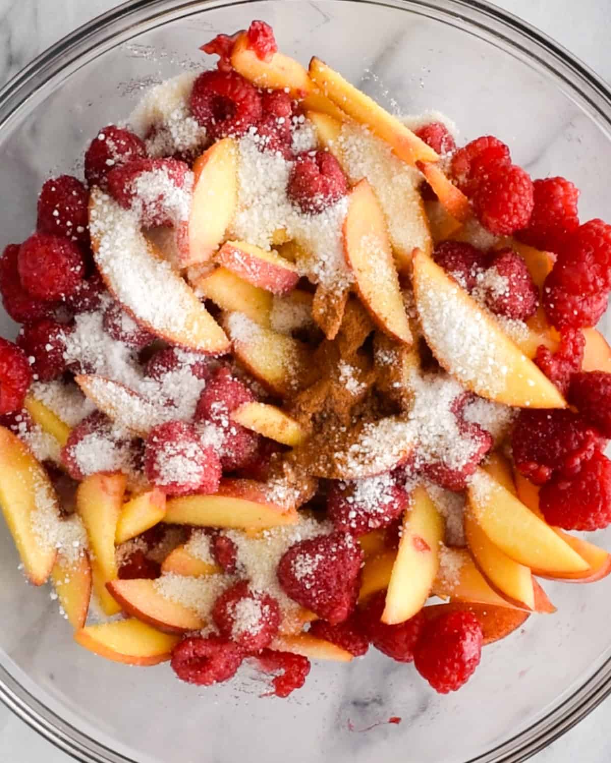 raspberry peach crisp filling in a bowl before mixing