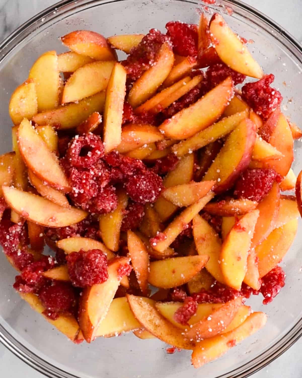 raspberry peach crisp filling in a bowl after mixing