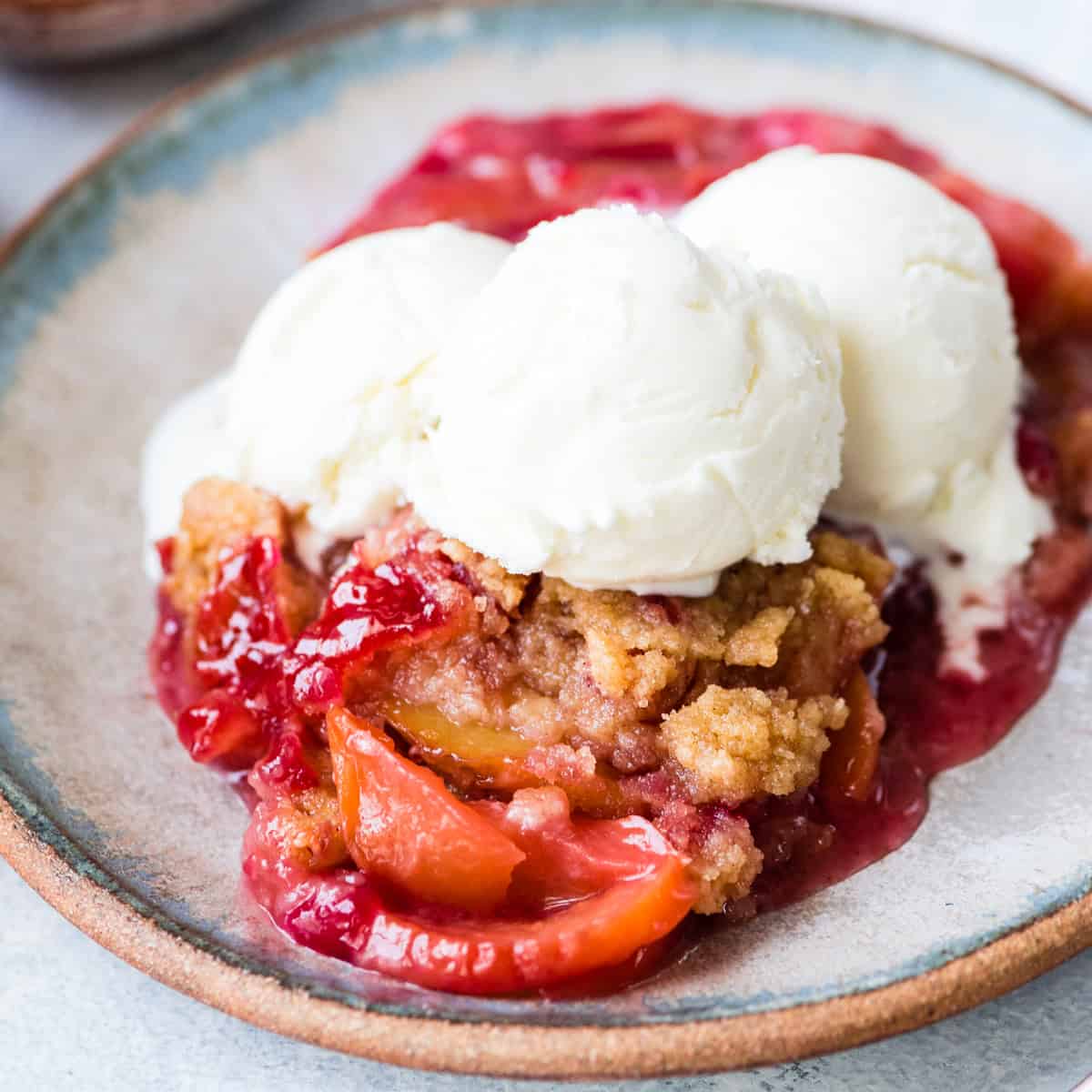 Raspberry Peach Crisp Recipe on a plate with 