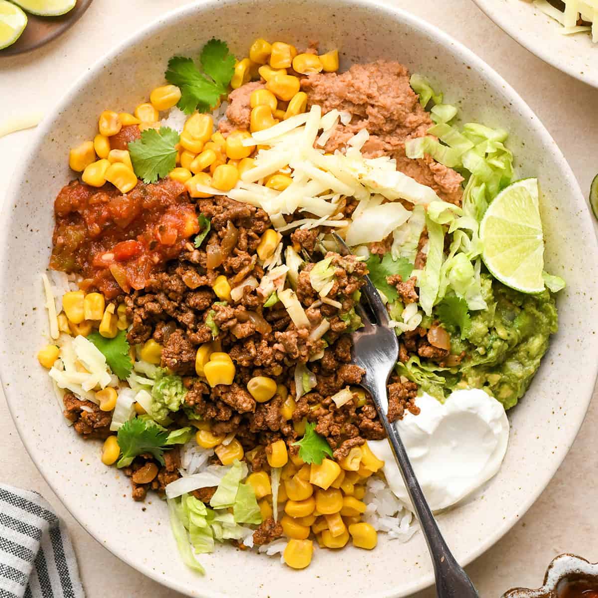 a taco bowl with a fork