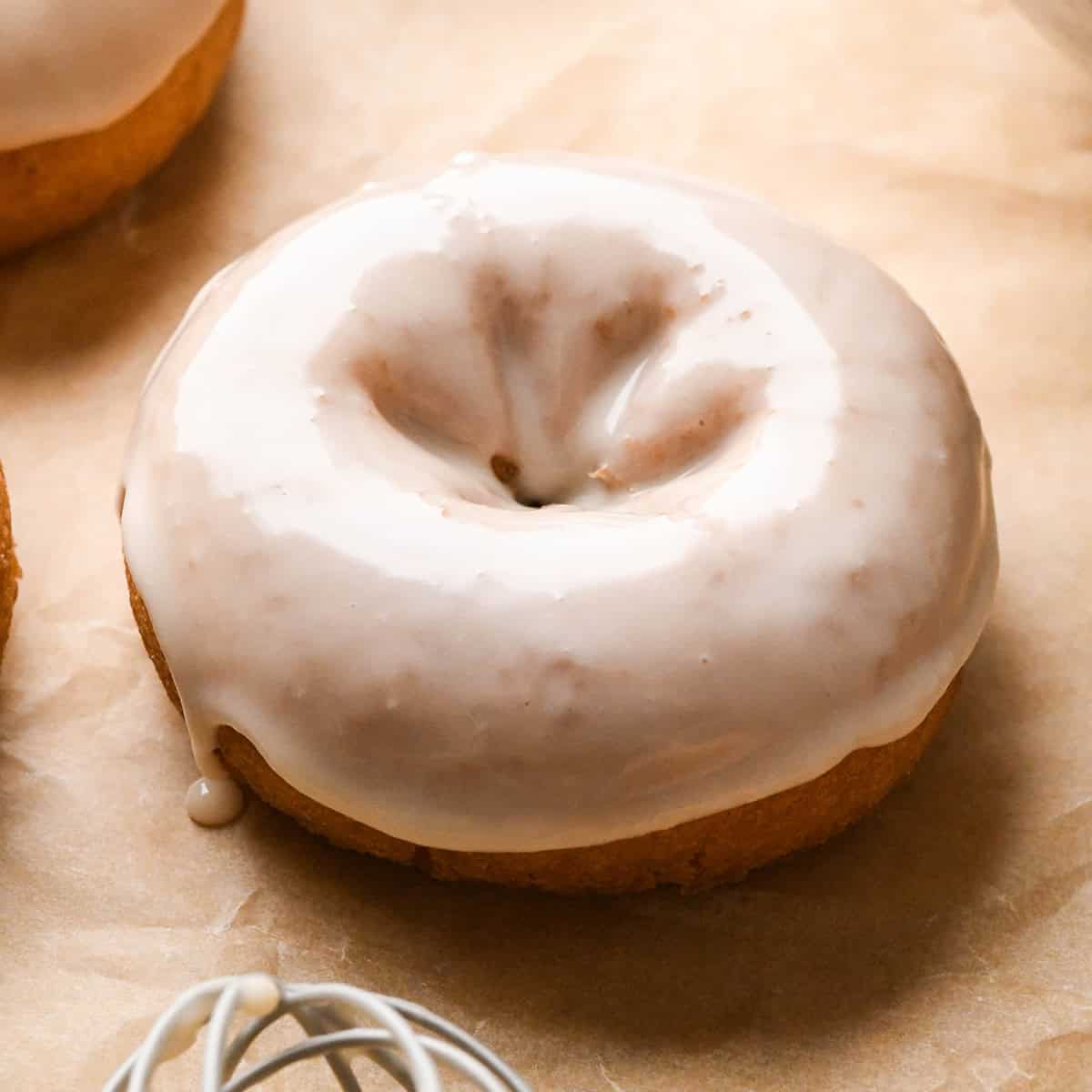 a donut after being dipped in Vanilla Icing