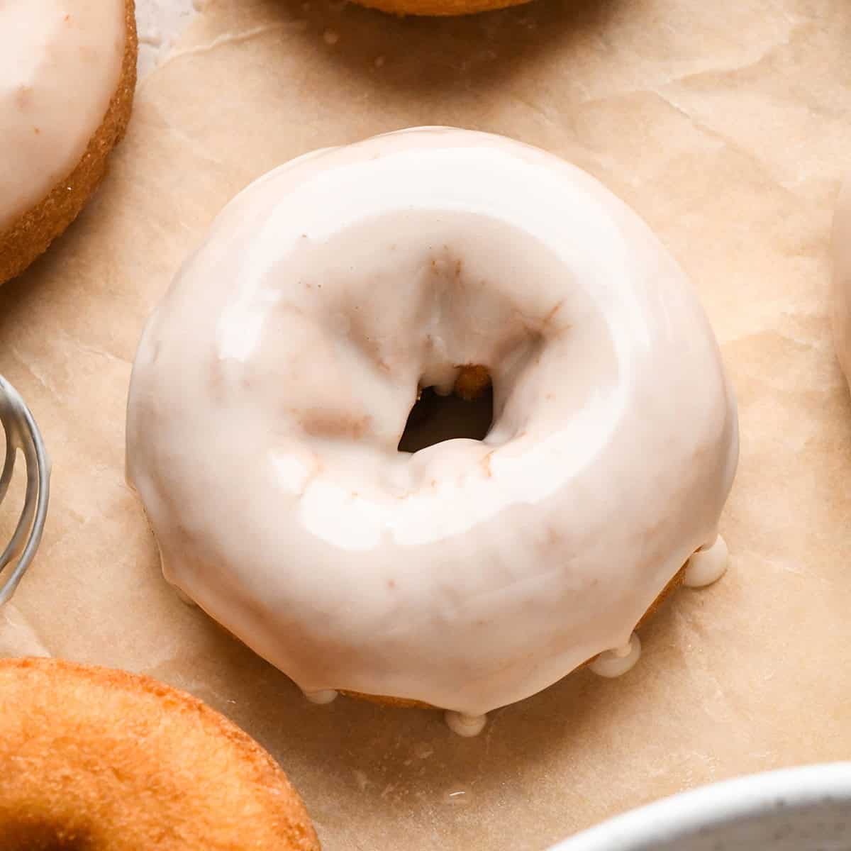 a donut dipped in vanilla icing