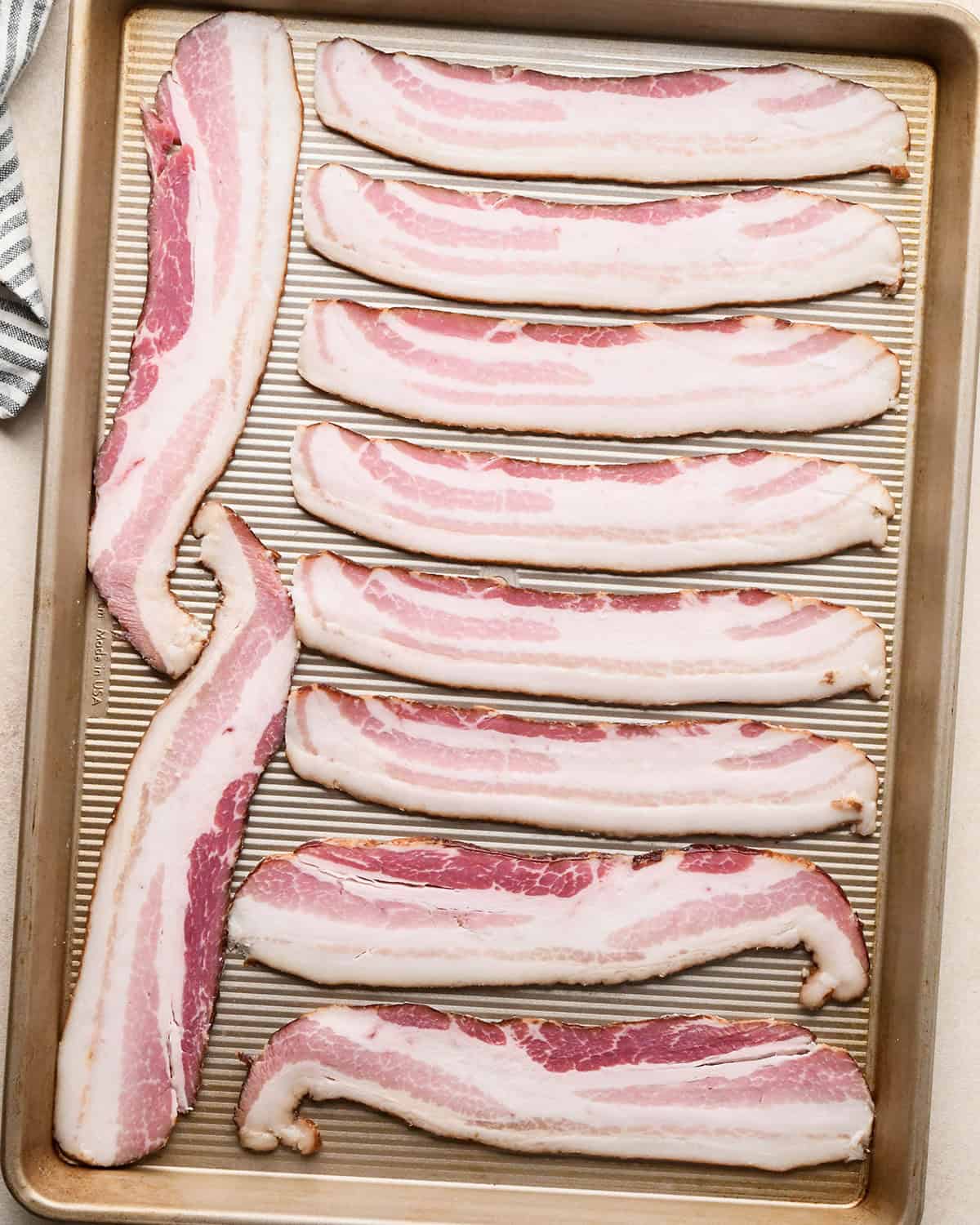 how to make BLT Pasta Salad Recipe - bacon on a baking sheet before cooking