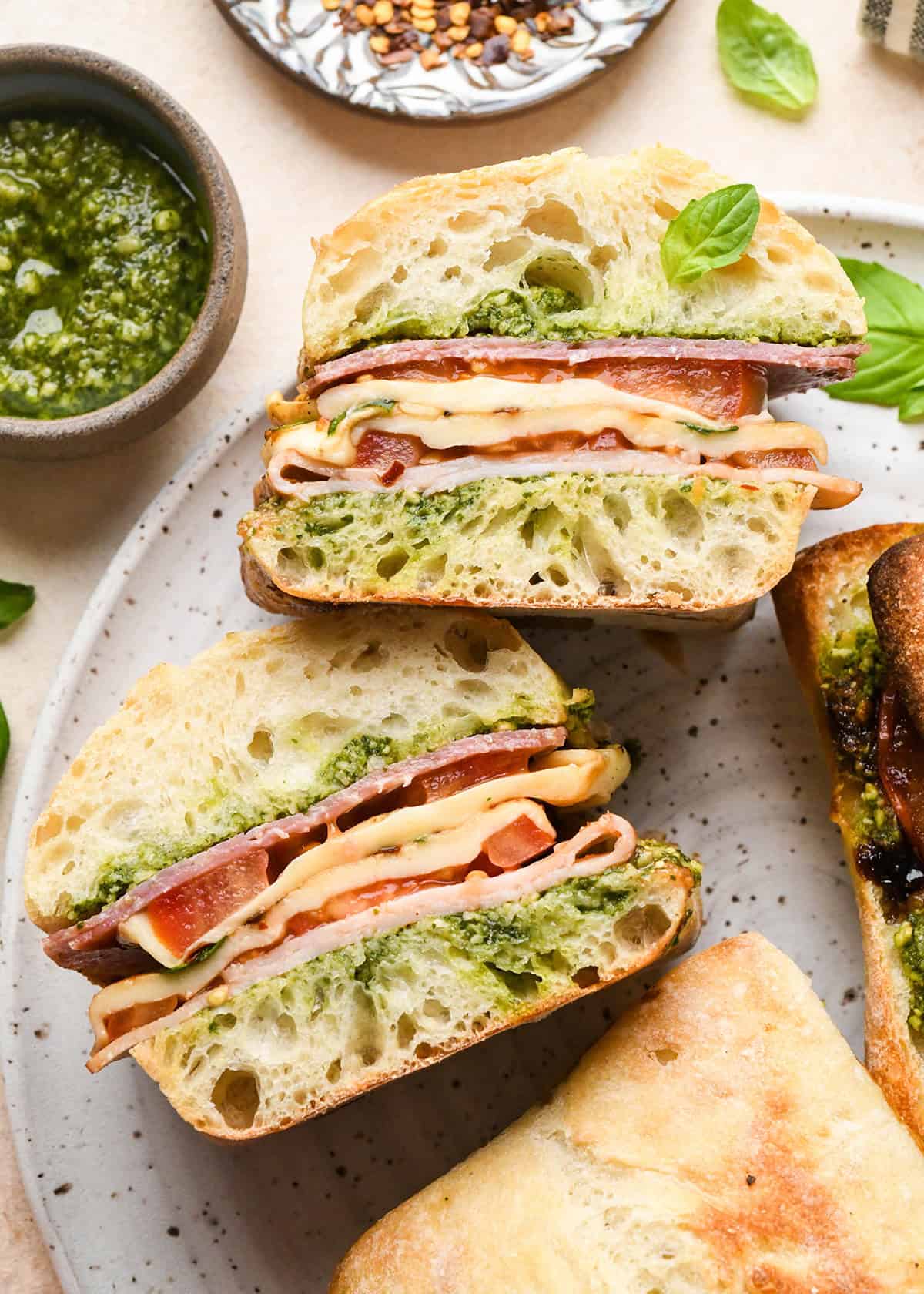 a Caprese Sandwich cut in half on a plate