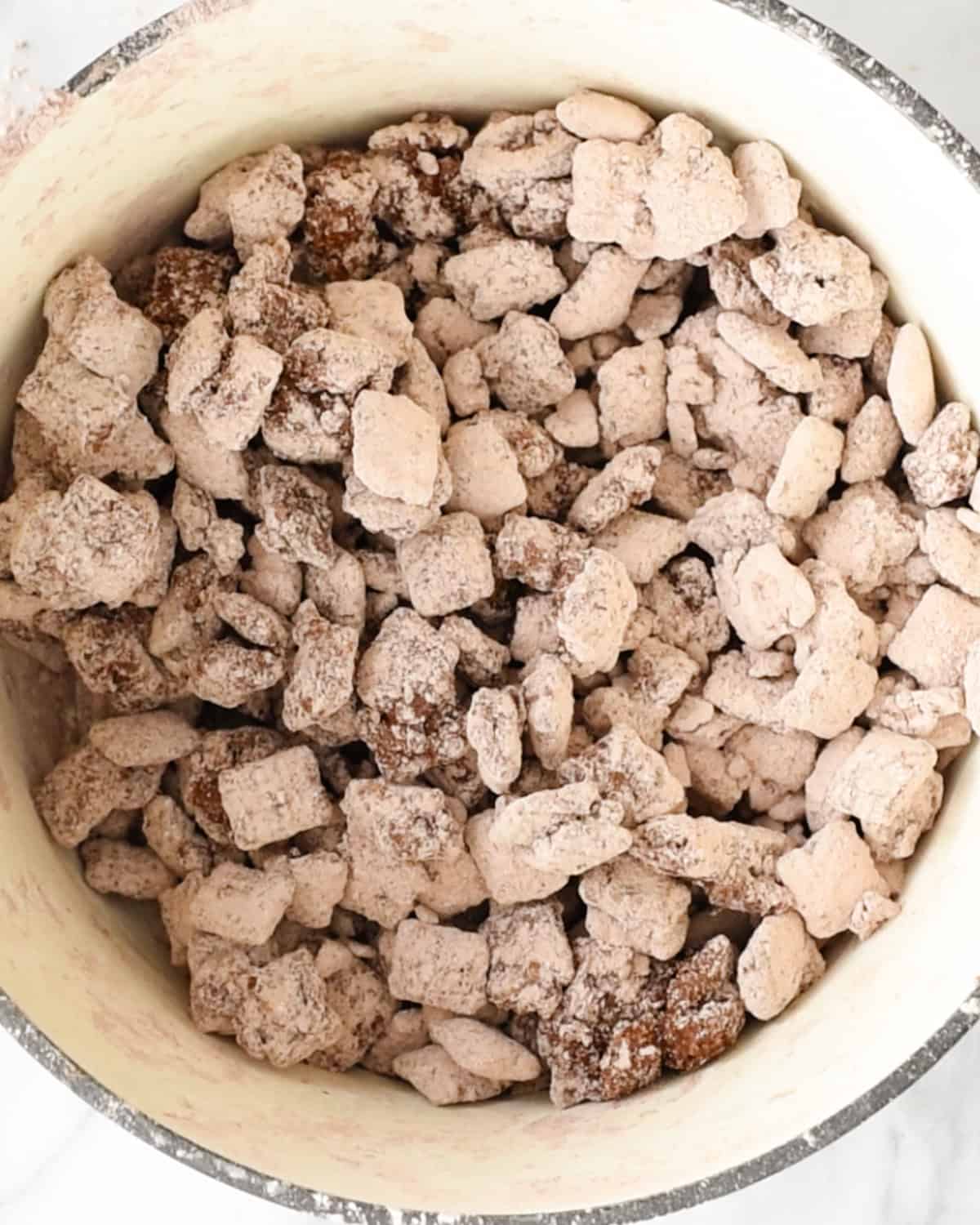 final dark chocolate puppy chow mixture in a bowl