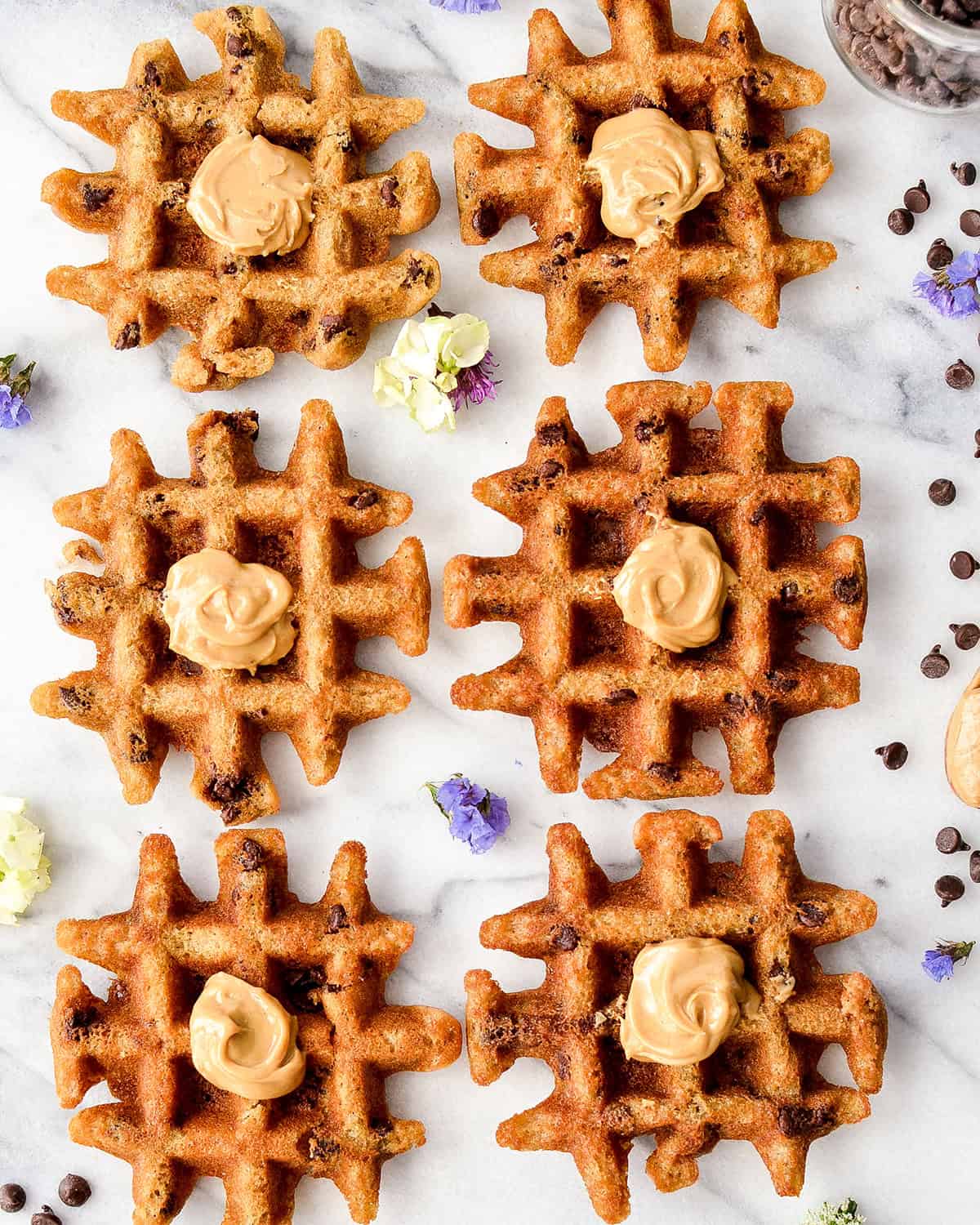 6 Gluten Free Peanut Butter Waffles with peanut butter on top
