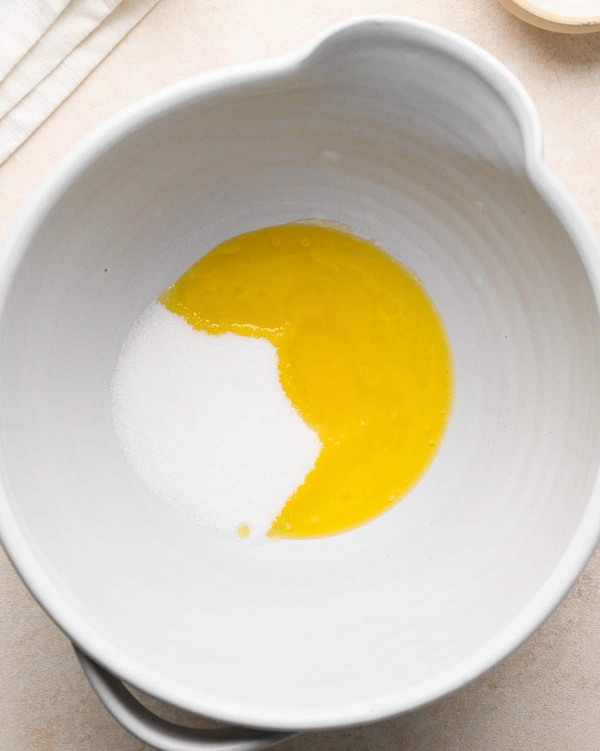 How to Make Blueberry Pancakes - butter and sugar in a bowl before mixing
