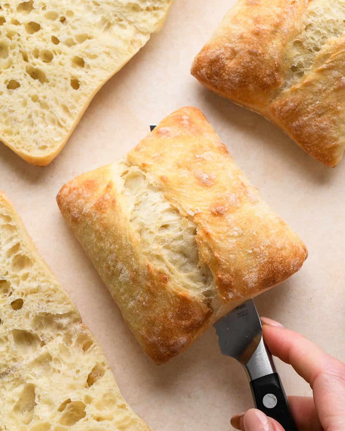 slicing bread to make Caprese Sandwich