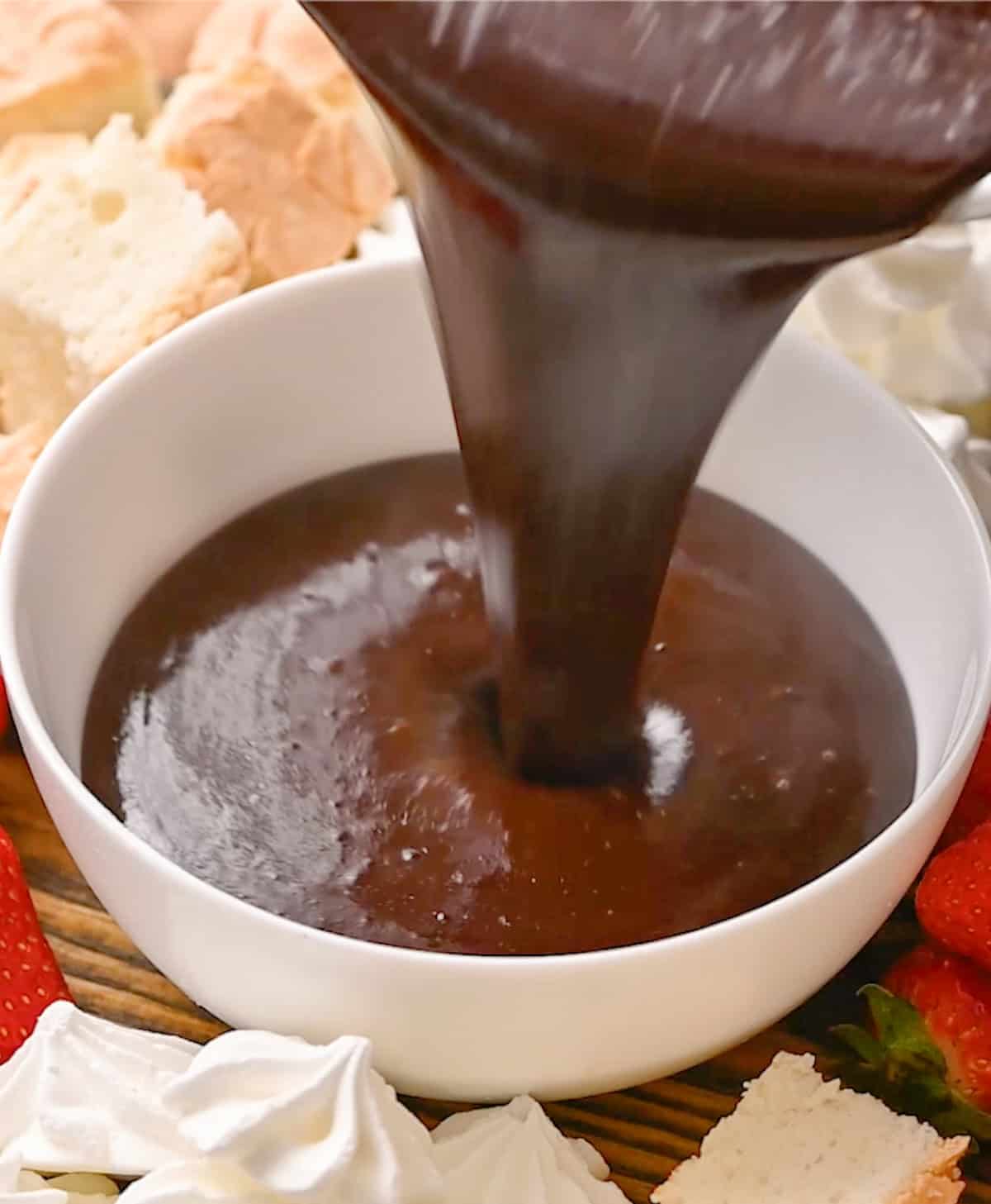  Chocolate Peanut Butter Fondue  being poured into a serving dish
