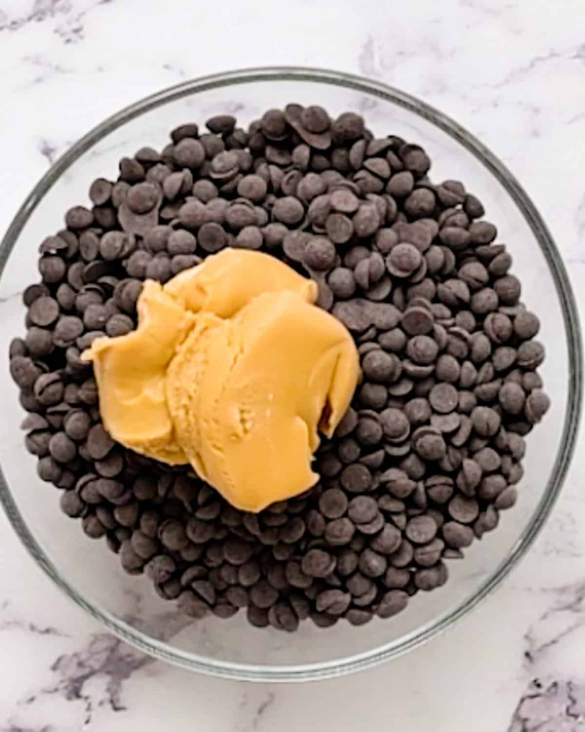 chocolate chips and peanut butter in a bowl before melting