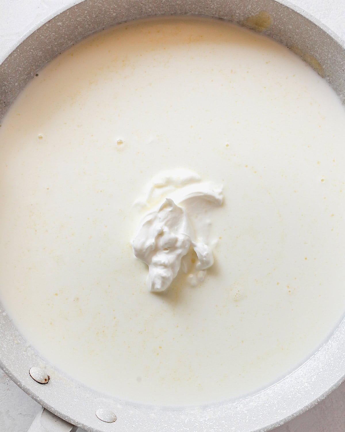 how to make Greek Yogurt Mac & Cheese - adding milk and greek yogurt to sauce