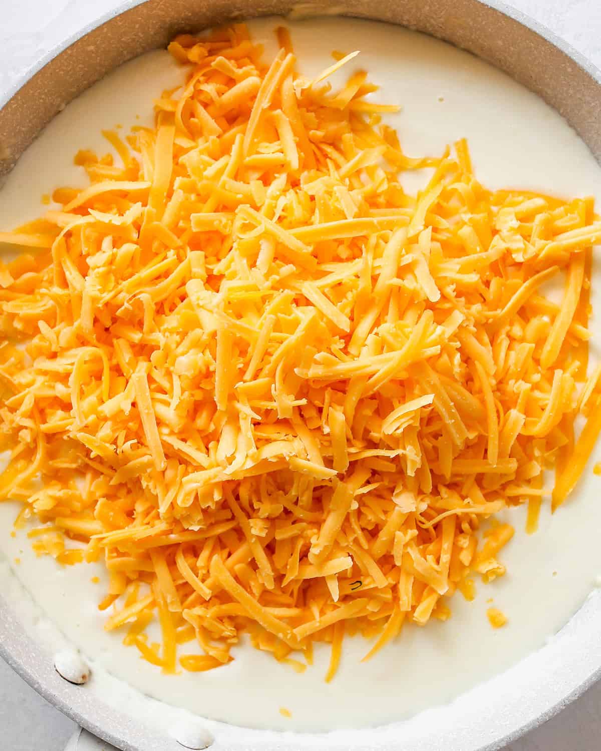 how to make Greek Yogurt Mac & Cheese - adding cheese to sauce 