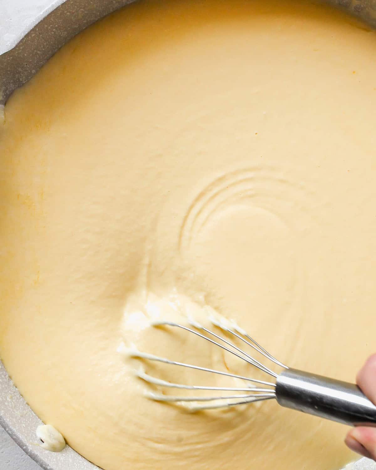 how to make Greek Yogurt Mac & Cheese - whisking cheese sauce