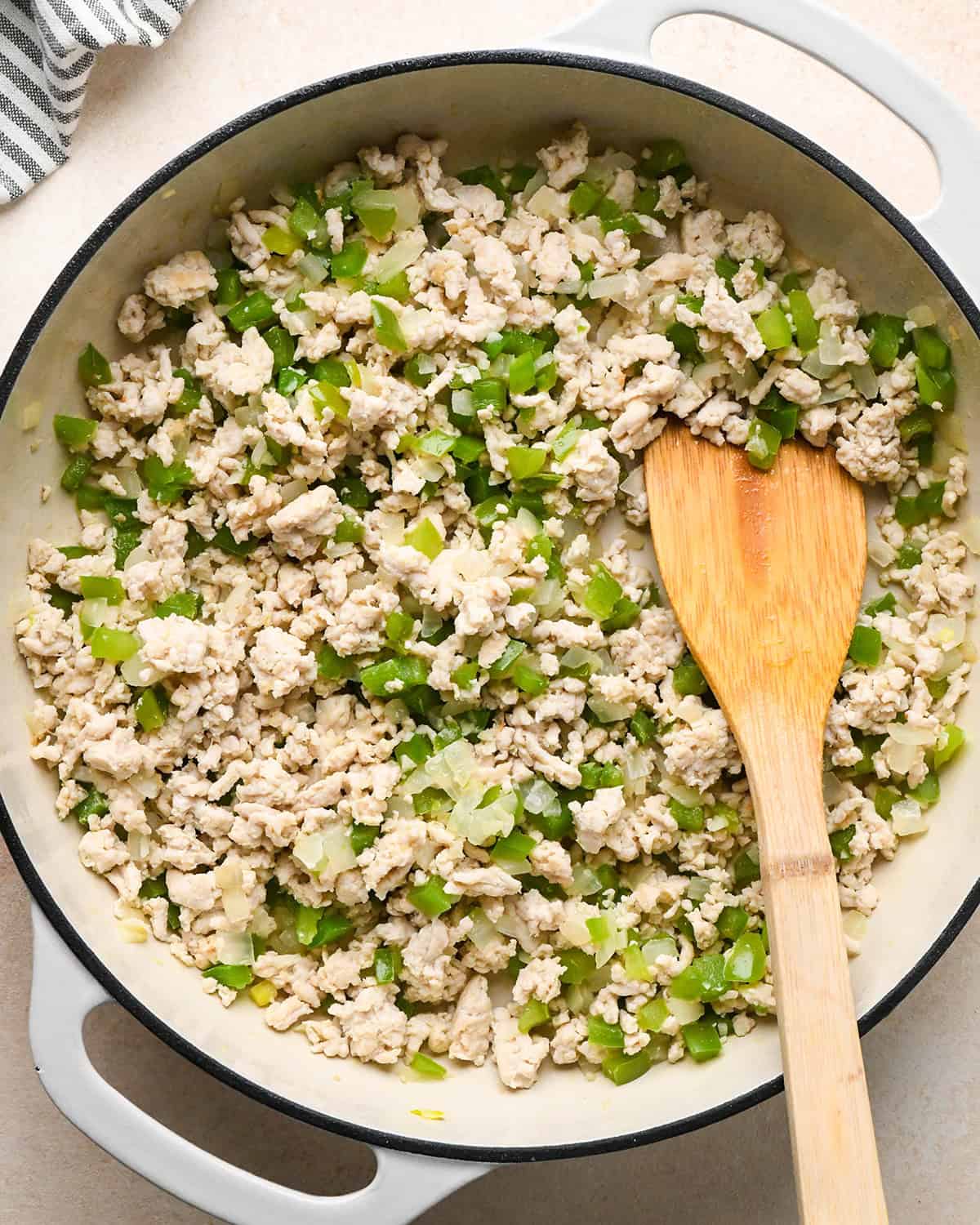 How to Make Ground Turkey Tacos - turkey, green pepper, onion, garlic and olive oil in a pan after cooking