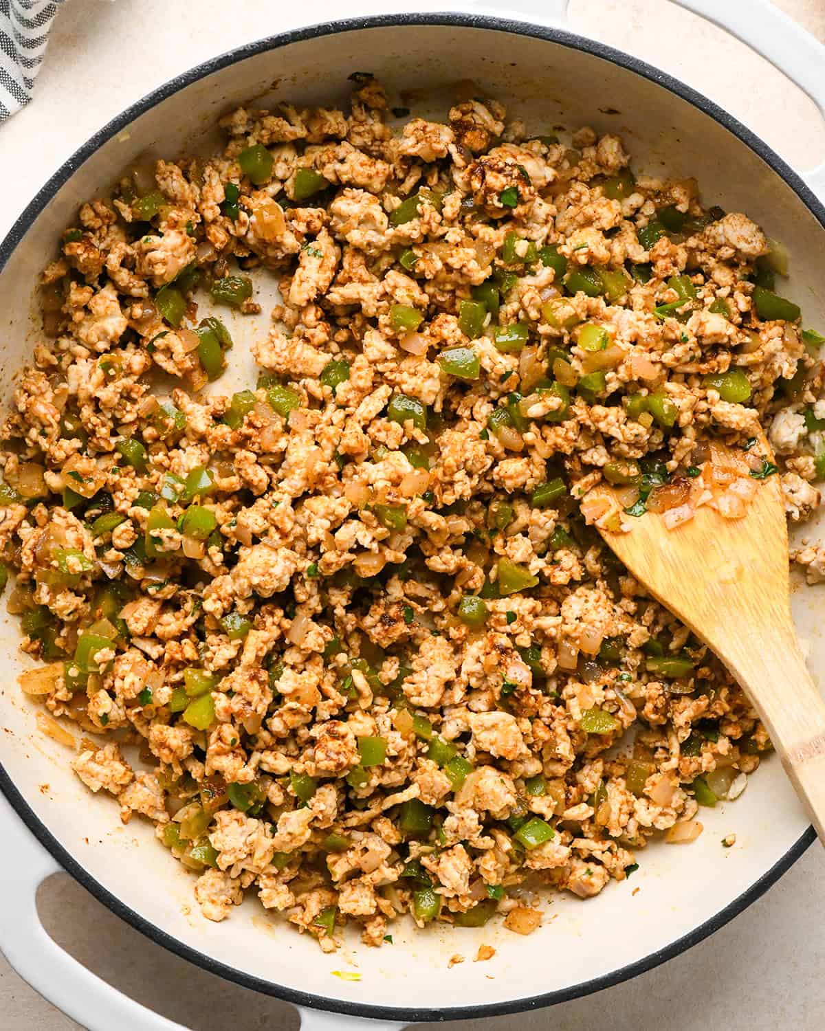 How to Make Ground Turkey Tacos - stirring in seasoning to ground turkey mixture