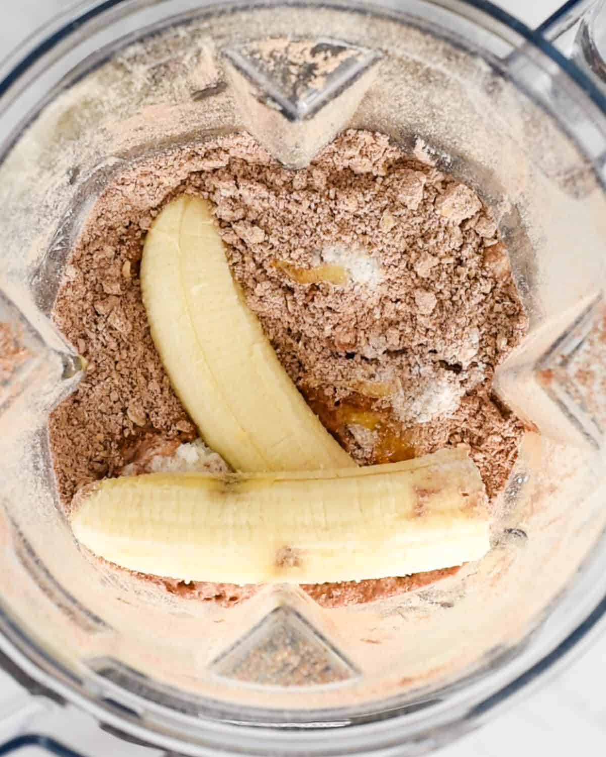 wet ingredients added to blending container before blending to make Healthy Chocolate Pancakes 