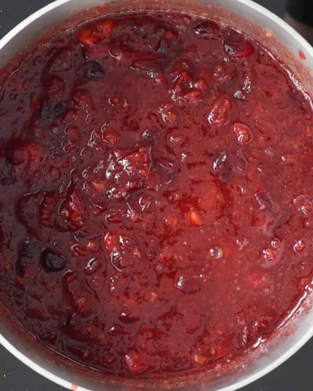 How to Make Healthy Cranberry Sauce - cranberries in a saucepan after being mashed